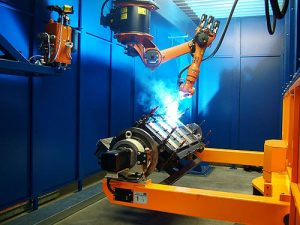 Kuka robot welding apart clamped into a jig